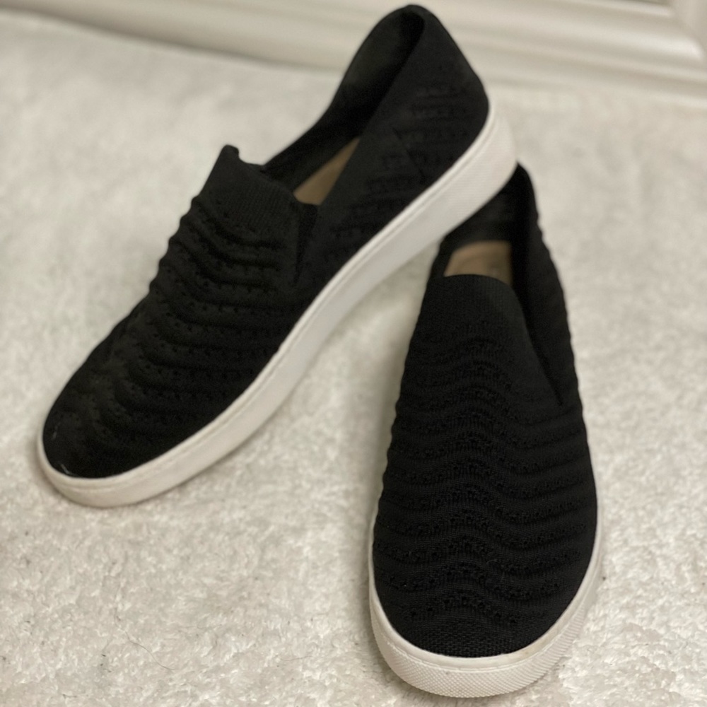 Woman’s size 8 black stretchy slip on shoe with white sole
